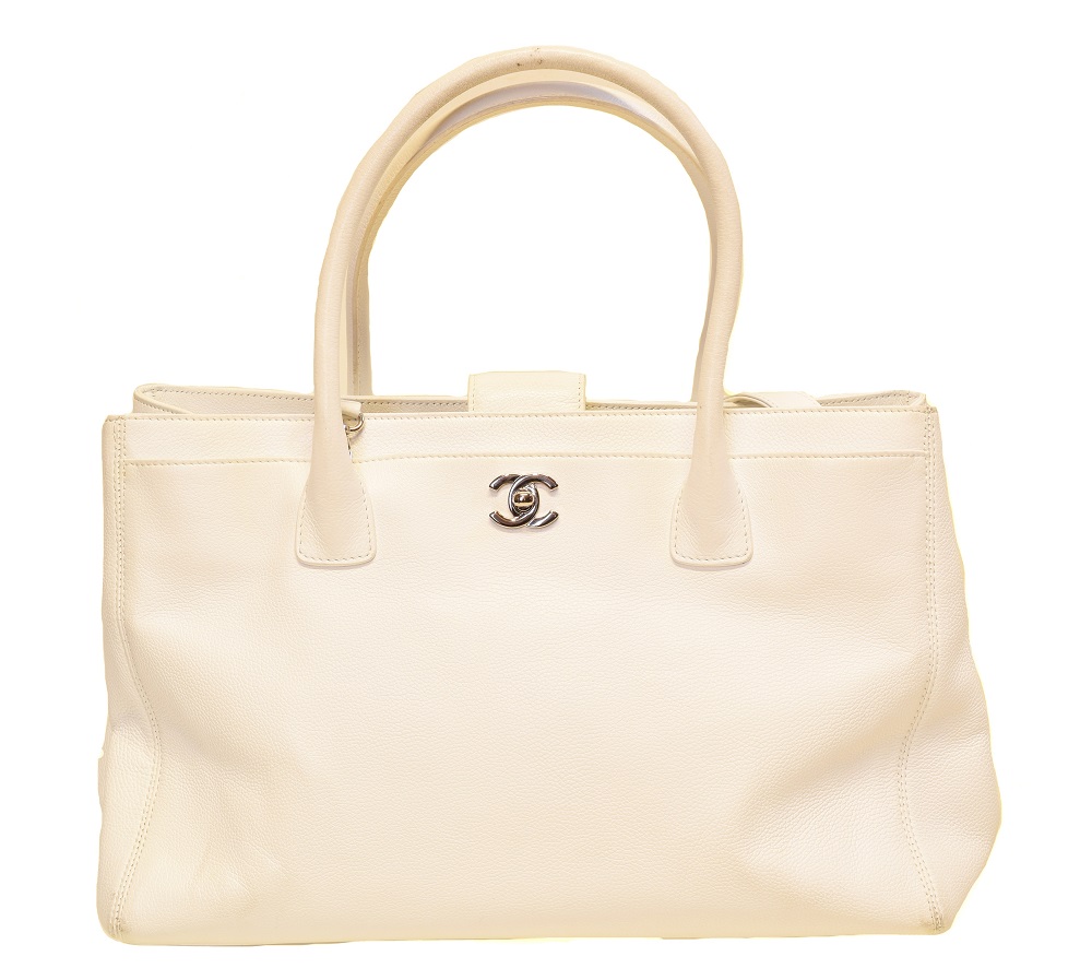 A Chanel Cerf Tote Shoulder Bag, circa 2008-9, the white grained calf leather exterior with white leather straps and silver-tone hardware, serial no. 12381545. With shoulder strap, maker's authenticty card and pouch.  (Qty: 1)  35.5x23.5x12cm  Sold for £1,269